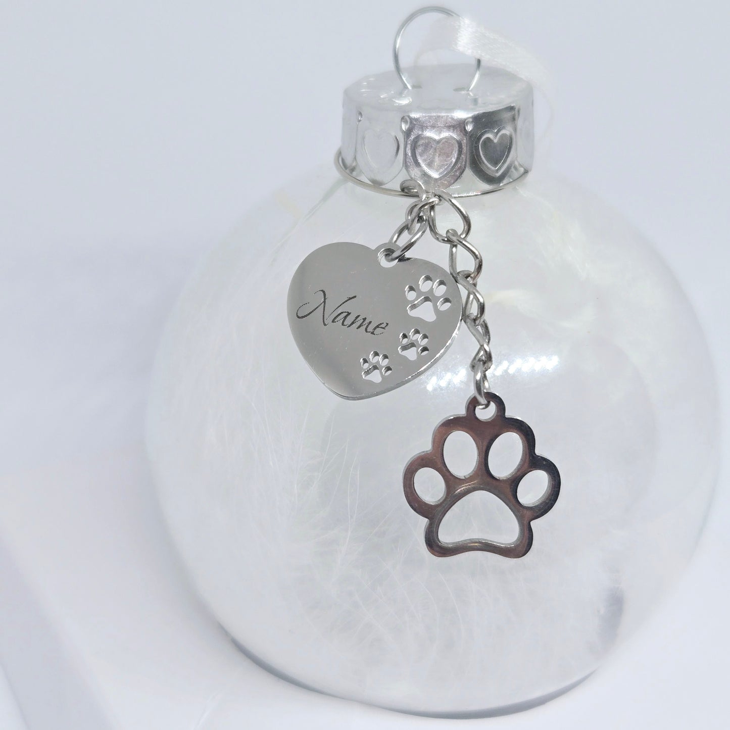 Clear glass ornament with silver paw charm and heart-shaped name tag 